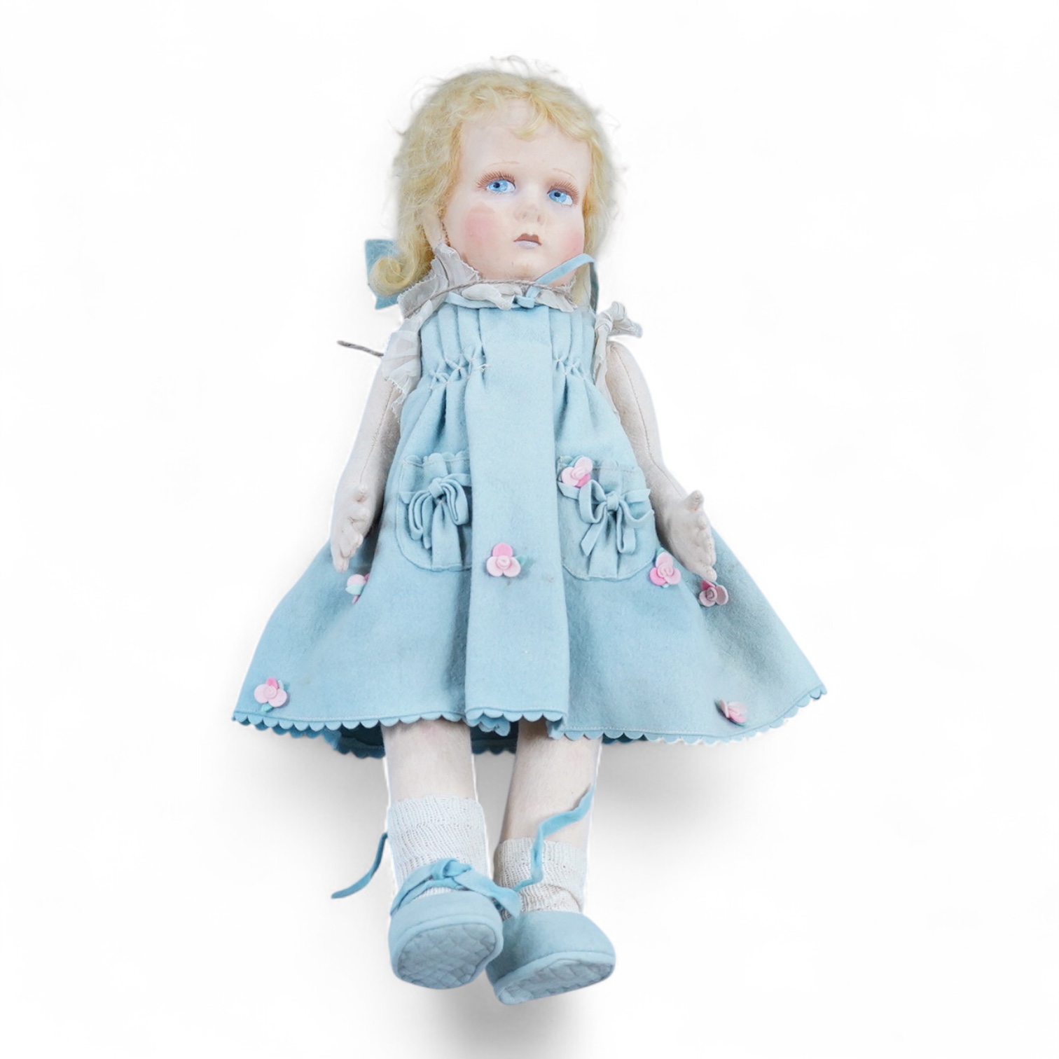 A wool felt Lenci doll with painted features to the face, 42cm long